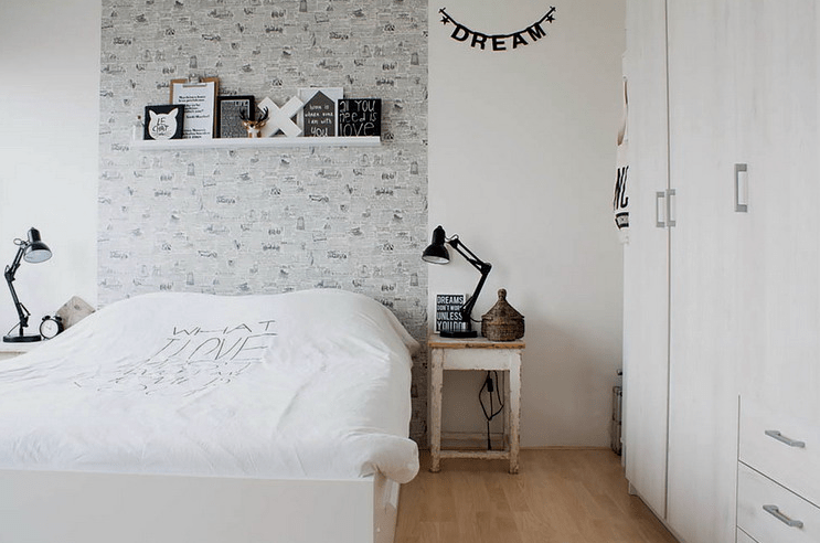 The bedroom has some shabby chic touches and more furniture too