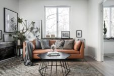 06 a Scandinavian apartment in grey, black and white with a tan leather Stockholm sofa for a warm touch
