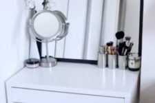 06 a small and stylish makeup nook done with a Micke desk, a comfy stool and some mirrors