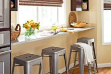 06 a windowsill breakfast bar with industrial stools and some storage shelves on both sides