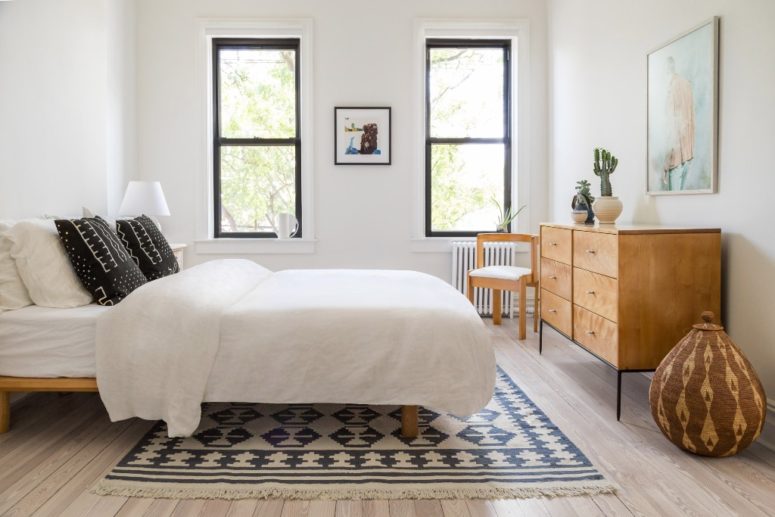 The bedroom is done with a bed, a light colored wooden sideboard and some artworks, nothing distracts from sleeping here The bedroom is done with a bed, a light-colored wooden sideboard and some artworks, nothing distracts from sleeping here