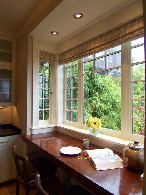 a cozy kitchen with a large windowsill as a breakfast zone and cool garden views