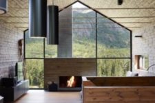 07 a fully glazed wall with a fireplace makes outside merge with inside