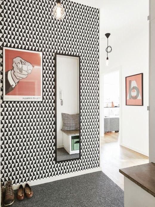 go for black and white geo print wallpaper for a mid-century modern space