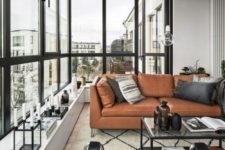 08 a gorgeous Scandinavian monochrome space is warmed up with a tan leather Stockholm sofa