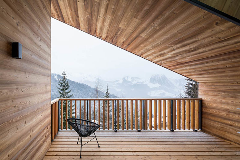 balcony in alps The balcony features only a black wicker chair and amazing views