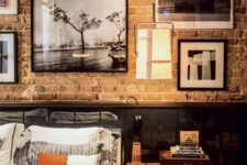09 an industrial masculine space with a wall covered with various artworks completely