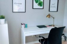 12 a modern working space with a Micke desk, a comfy black armchair and several artworks for a cool look