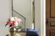 13 a refined vintage mustard-colored upholstered bench and an exquisite mirror for a vintage space
