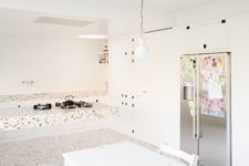 13 a terrazzo floor, countertops and a floating kitchen island for a trendy look