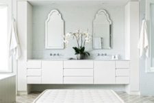 13 an oversized neutral upholstered ottoman as a comfy seating in your bathroom
