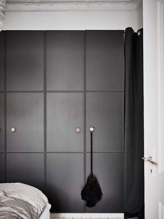 graphite grey paneled doors with small knobs for a Pax wardrobe