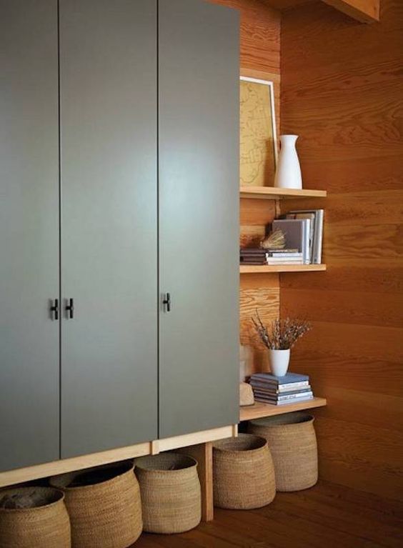 IKEA Dombas wardrobe put on tall legs for additional storage space, re-painted in grey and with stylish knobs