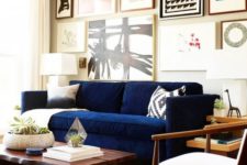 15 a navy Stockholm sofa makes a colorful statement in this monochromatic space
