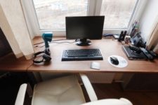 15 a small working space on the windowsill and a comfy white leather chair