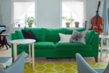 16 an emerald Stockholm sofa, a yellow rug and powder blue chairs add color to the space and make it bold