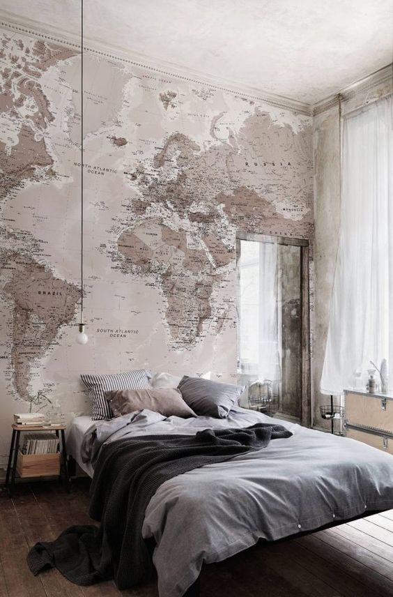 a large map wall mural on the headboard wall is ideal for travel fans