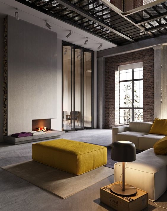 a large sunny yellow ottoman fits a minimalist interior and adds color to the space