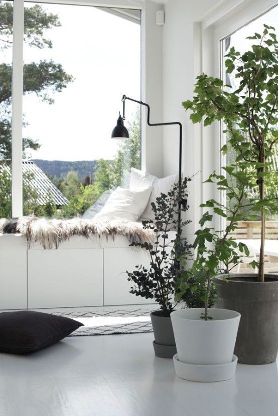 a comfy windowsill daybed with pillows and faux fur and Besta drawers by IKEA