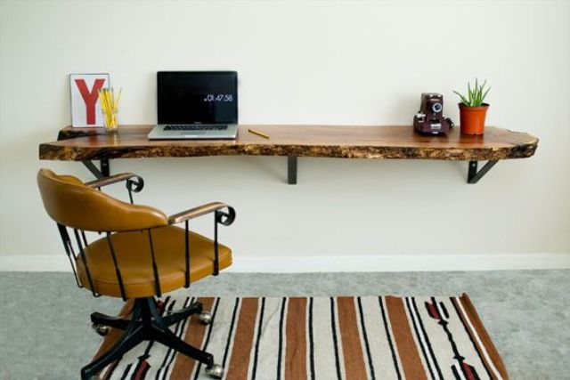 a floating desk of a wooden slab with a live edge will bring a natural touch