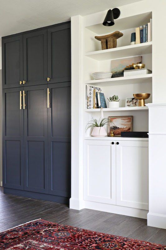 navy paneled front doors plus brass handles give a Pax item a chic look