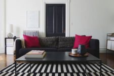 23 a Stockholm rug and sofa for a monochrome interior and a couple of fuchsia pillows for a colorful splash