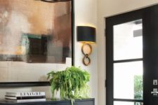 23 a creative geometric metal chandelier with modern candles for an art deco space