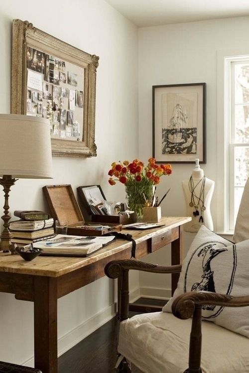 a vintage-styled pinboard with burlap and a vintage picture frame