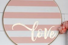 24 a striped blush and white wooden sign with gold calligraphy