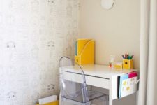28 a small and fun kid’s workspace with a Micke desk, an acrylic chair and some bold yellow touches