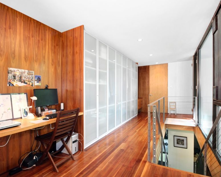 Continue your wood wall treatment on a closet to make it look really stylish. (Rusafova Markulis Architects)