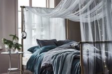 03 a sheer and airy bed canopy with string lights for comfortable sleeping