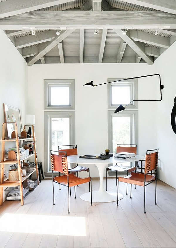 The home office or designer's studio is done with industrial touches just look at those metal and leather chairs The home office or designer's studio is done with industrial touches - just look at those metal and leather chairs