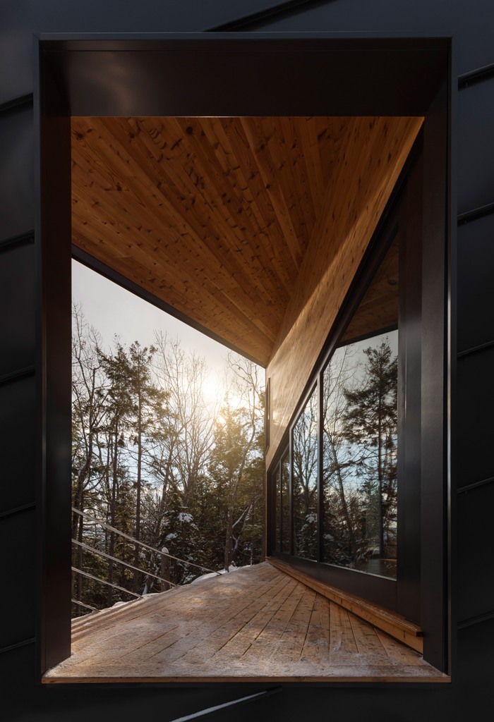 The wooden deck allows to enjoy the views and forests around, and warm colored timber combines nice with black metal The wooden deck allows to enjoy the views and forests around, and warm-colored timber combines nice with black metal