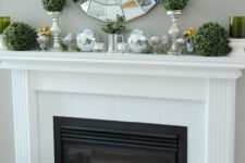 06 boxwood balls and eggs in glasses are all you need for a stylish spring mantel