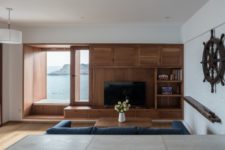 07 Large windows with comfy windowsills allow enjoying the views of the sea