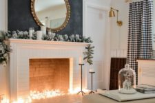 09 put some string lights into the fireplace to imitate light – it will instantly add coziness