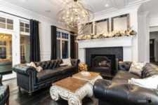 10 a chic black and white space with a couple of black leather Chesterfields and some other classic touches