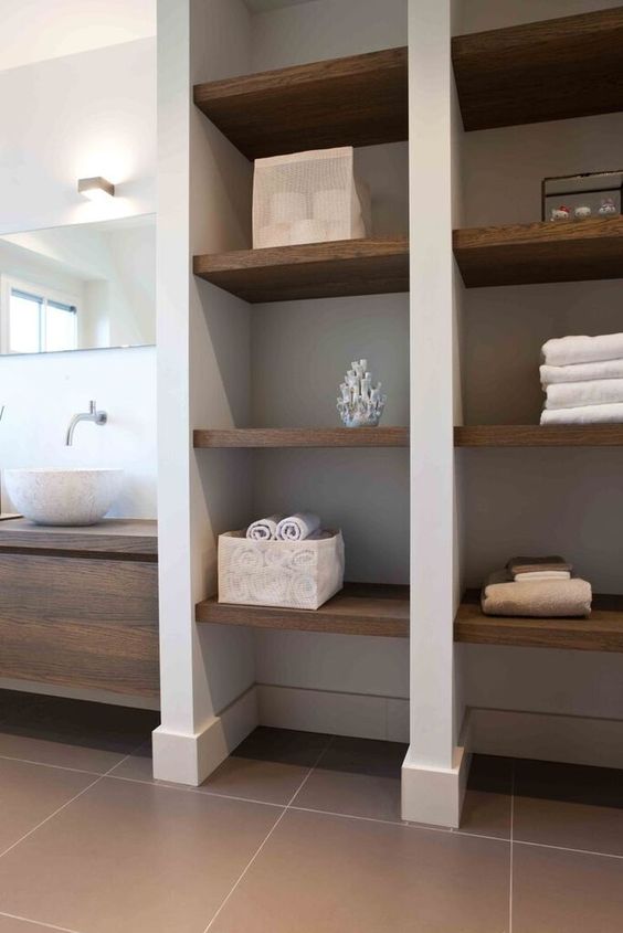 open shelves next to the floating vanity