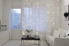 11 string lights on curtains to add light, accent the window and add a sparkly touch