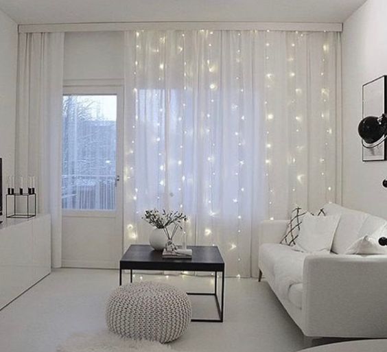 string lights on curtains to add light, accent the window and add a sparkly touch