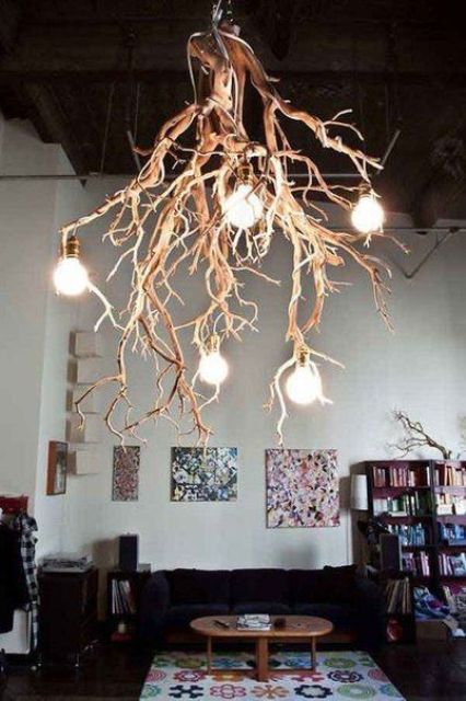a fantastic branch chandelier with bulbs steals the show in this room