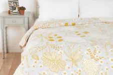 13 a pretty yellow floral and botanical print blanket is all you need to refresh the space for spring