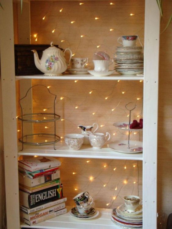 a usual cabinet highlighted with string lights that turn it into a cool display with a bold accent