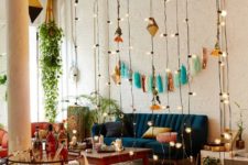 14 separate an open space with string lights hanging – it’s a cute and glam idea for any space