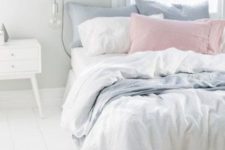 15 some powder blue and blush pillows will turn a white bed into a springy
