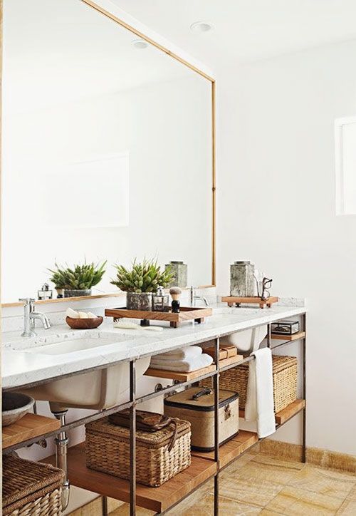 an industrial double vanity features open shelves inside