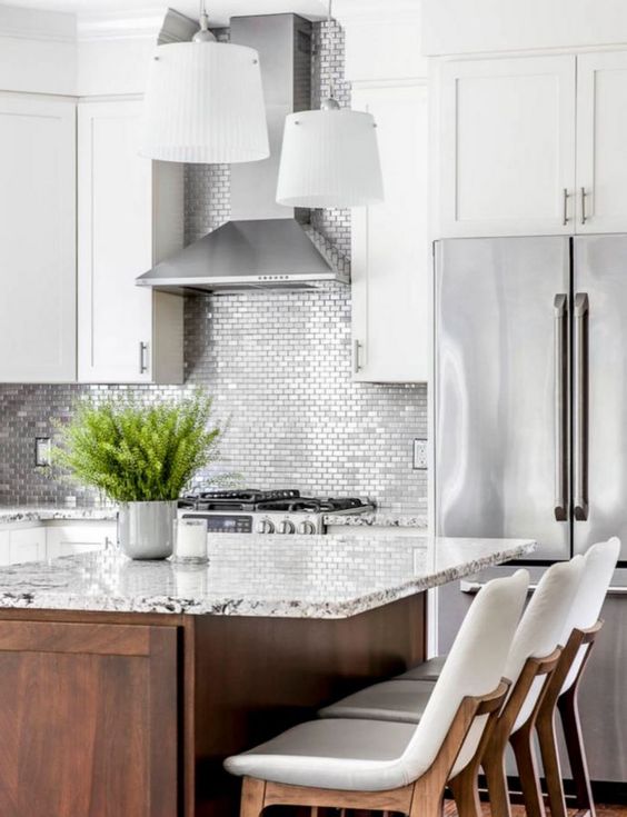 small scale silver tiles in a white kitchen for a bold and shiny touch