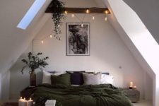 17 string lights and candles to add more light to this attic bedroom