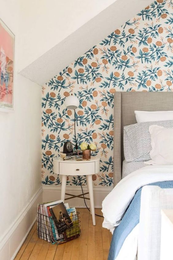 retro-inspired floral wallpaper on the headboard wall for a spring fell